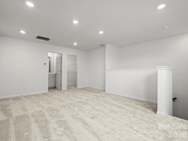 Loft space with walk in closet and full bath-Representative photo