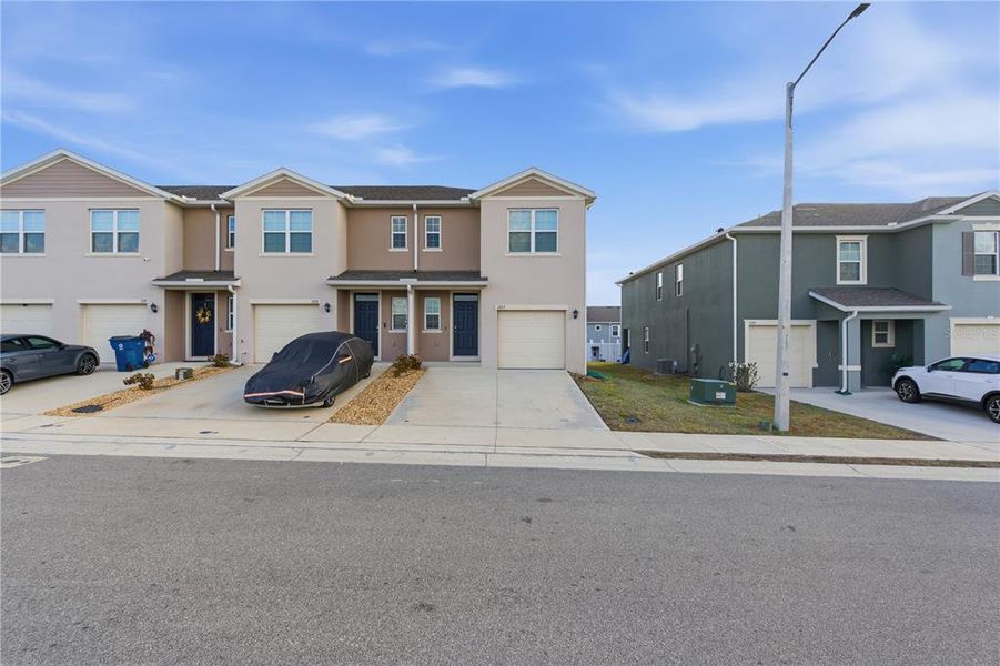 Front exterior of a new home in Brentwood, Davenport, FL, highlighting curb appeal (Image 24).
