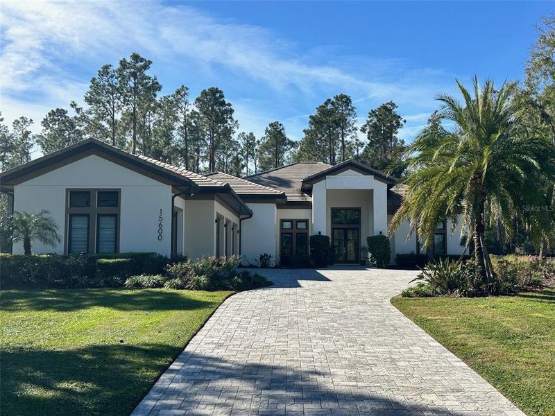 Front exterior of a new home in , Montverde, FL, highlighting curb appeal (Image 1). Front exterior of a new home in , Montverde, FL, highlighting curb appeal (Image 1).