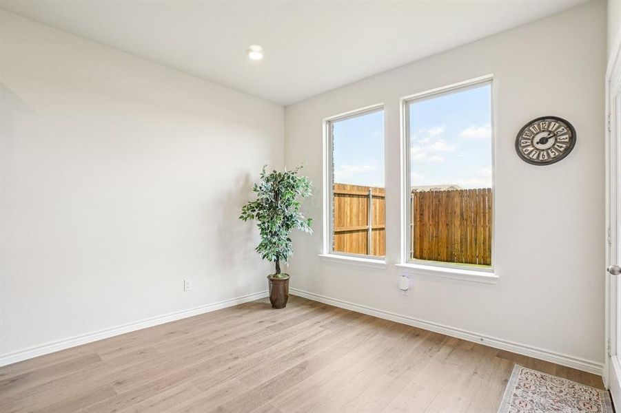 Spare room featuring light wood-style flooring and recessed lighting Spare room featuring light wood-style flooring and recessed lighting