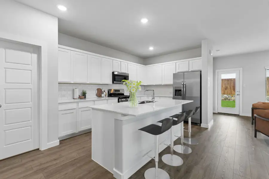 Kitchen in the Oscar home plan by Trophy Signature Homes – REPRESENTATIVE PHOTO Kitchen in the Oscar home plan by Trophy Signature Homes – REPRESENTATIVE PHOTO