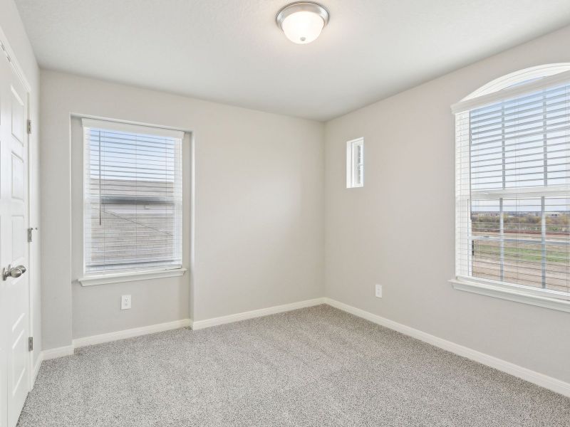 Guest bedroom in the San Jacinto floorplan at a Meritage Homes community.