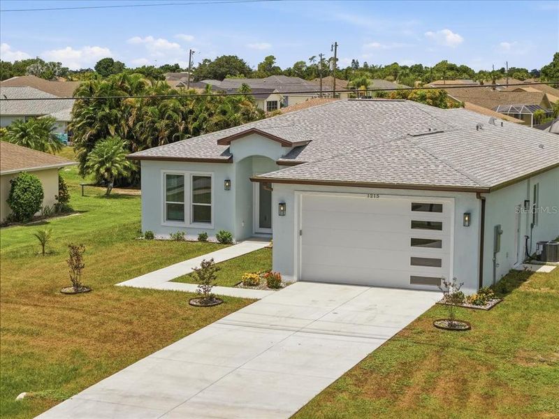 Front exterior of a new home in , Punta Gorda, FL, highlighting curb appeal (Image 30).