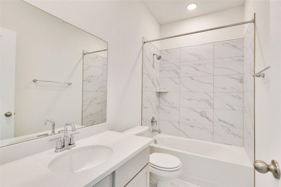 Full bathroom with shower / bathtub combination and vanity Full bathroom with shower / bathtub combination and vanity