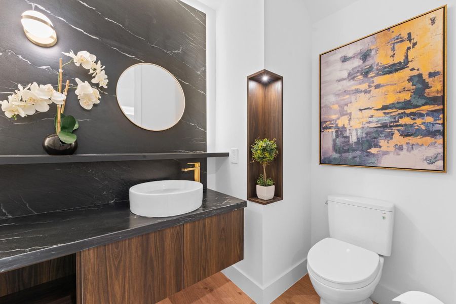 Unexpected drama with dark wood, black marble, and brass accents — designed to wow your guests at every visit.