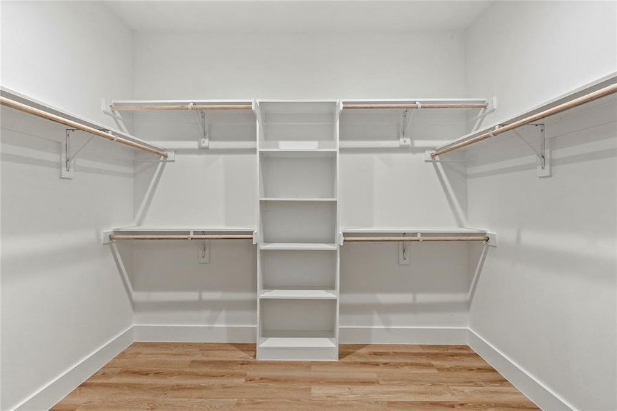 Spacious closet featuring wood finished floors Spacious closet featuring wood finished floors