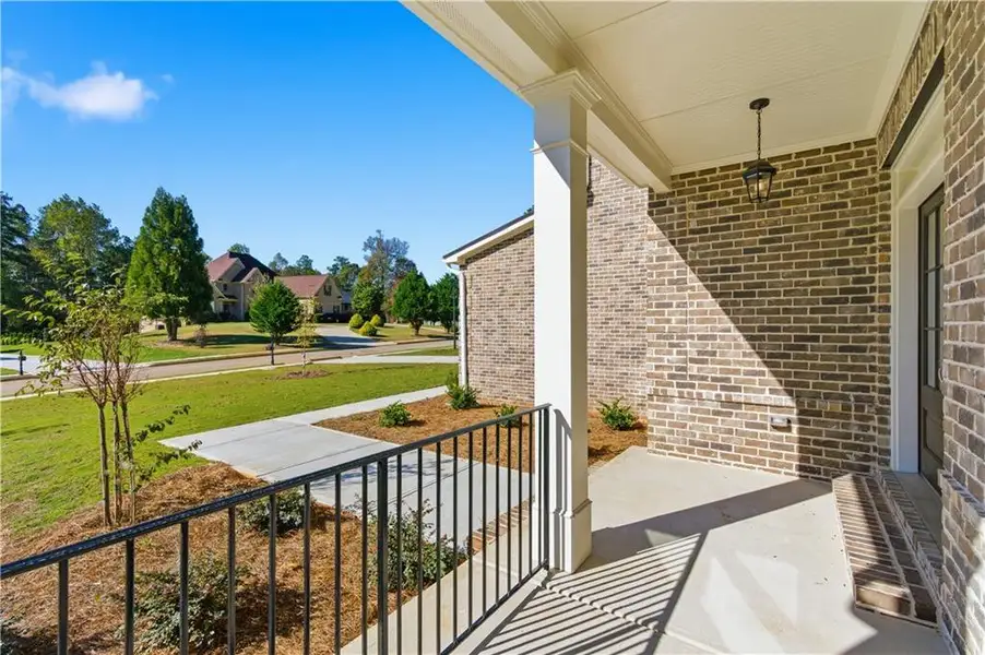 Exterior details and patio area of a home in The Estates at Hurricane Pointe, Douglasville (Image 28).