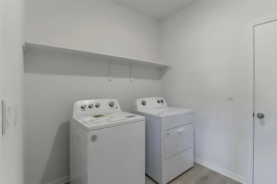 Furnished interior view inside a new home in Bar W Ranch, Leander (Image 3). Furnished interior view inside a new home in Bar W Ranch, Leander (Image 3).