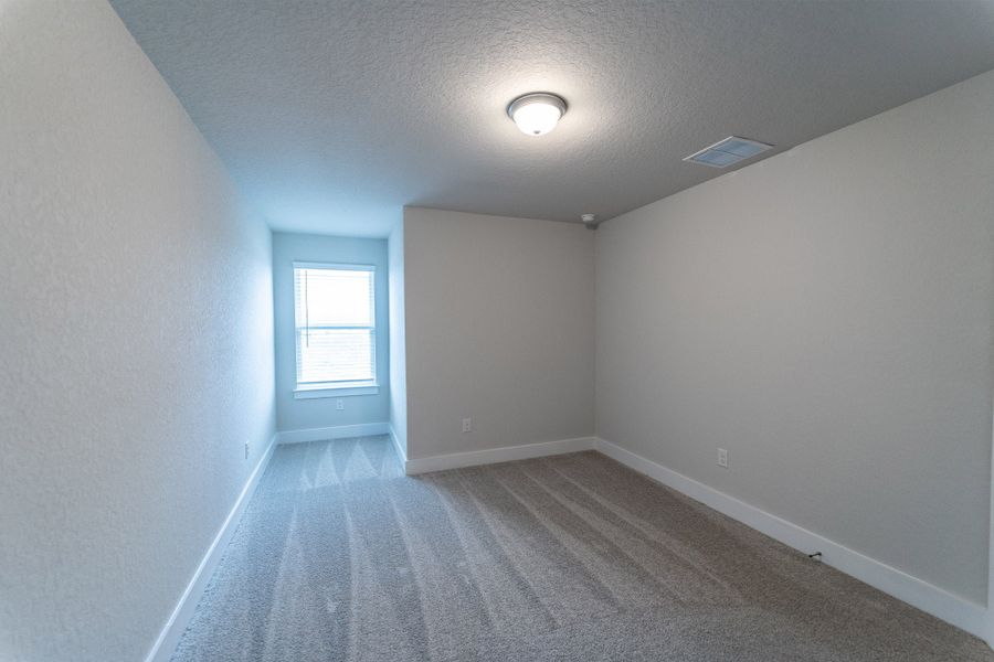 Spacious, unfurnished interior of a new home in The Woodlands at Medina Hills, Mico (Image 17).