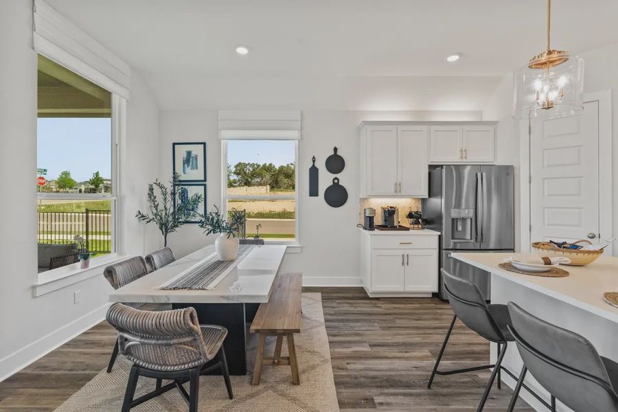 Representative furnished interior of a home built from the Mia by Chesmar Homes in Sweetwater, Austin (Image 12).