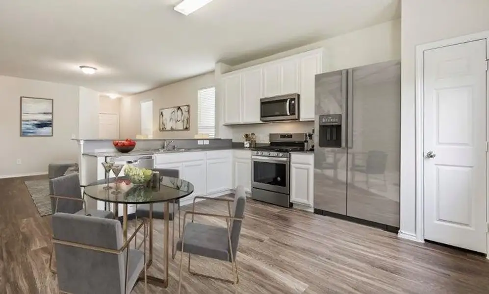 Furnished interior view inside a new home in The Pines At Seven Coves, Conroe (Image 3).