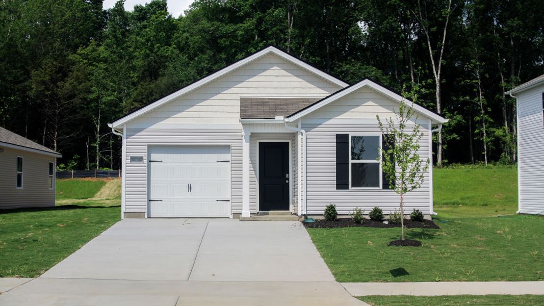 Front exterior of a new home in Saddle Trace, Lewisburg, TN, highlighting curb appeal (Image 1).