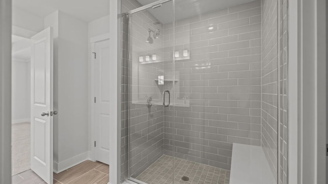 Burton Design fully-tiled shower with seat and premium finishes. At Lakeside Glen by DRB Homes in York, SC. Burton Design fully-tiled shower with seat and premium finishes. At Lakeside Glen by DRB Homes in York, SC.