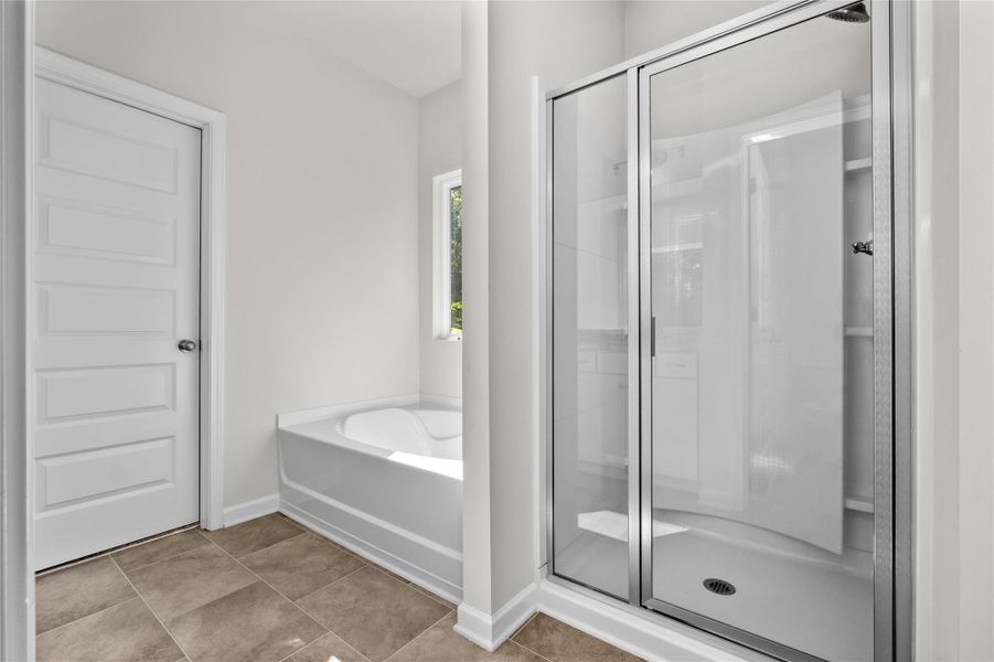 The Coleman- Primary Bathroom with Separate Tub and Shower. Home under construction, photo used for illustrative purposes only, colors and options will vary. The Coleman- Primary Bathroom with Separate Tub and Shower. Home under construction, photo used for illustrative purposes only, colors and options will vary.