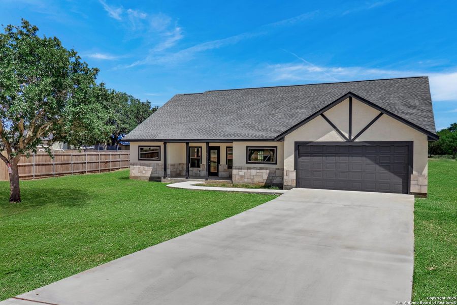 Front exterior of a new home in , Lytle, TX, highlighting curb appeal (Image 29). Front exterior of a new home in , Lytle, TX, highlighting curb appeal (Image 29).