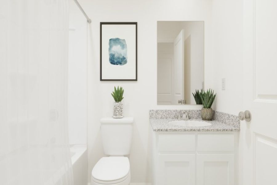 A bathroom with a toilet and a sink.