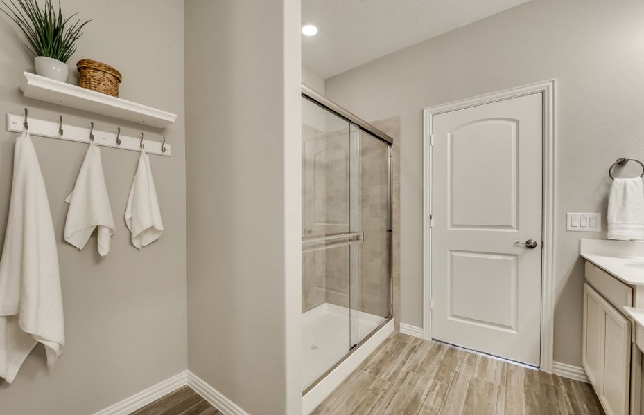 Spacious owner's bath with large shower