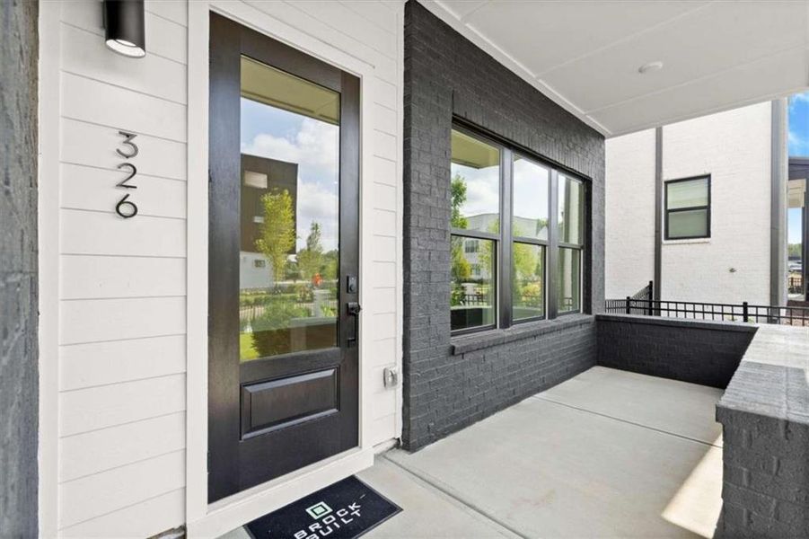 Exterior details and patio area of a home in The Gathering – Alpharetta, Alpharetta (Image 28).