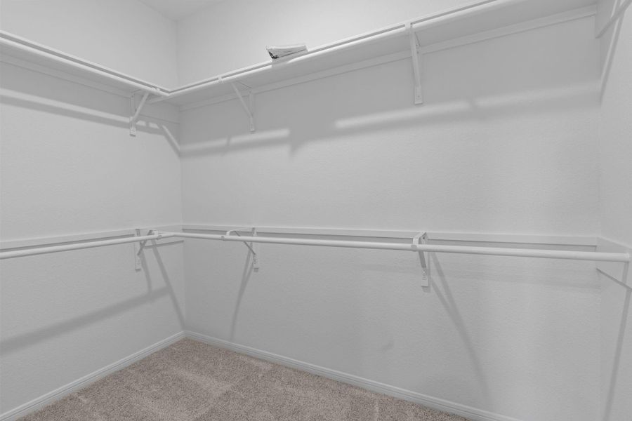 A view of your large primary walk-in Closet
