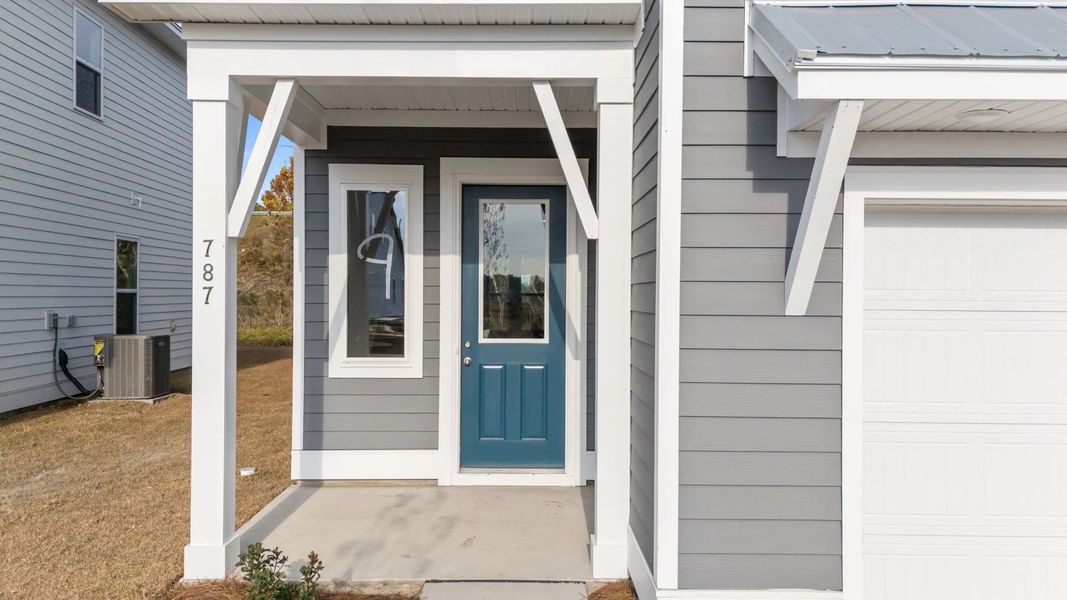 Exterior details and patio area of a home in Blue Heron Retreat: Oasis Series, Little River (Image 3).
