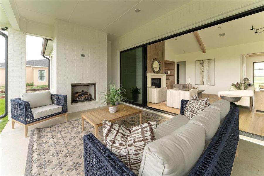 View of patio with an outdoor living space with a fireplace View of patio with an outdoor living space with a fireplace