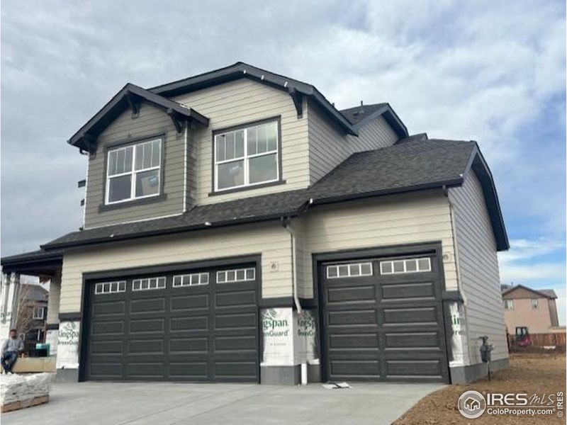 Front exterior of a new home in Cherry Meadows, Brighton, CO, highlighting curb appeal (Image 2). Front exterior of a new home in Cherry Meadows, Brighton, CO, highlighting curb appeal (Image 2).