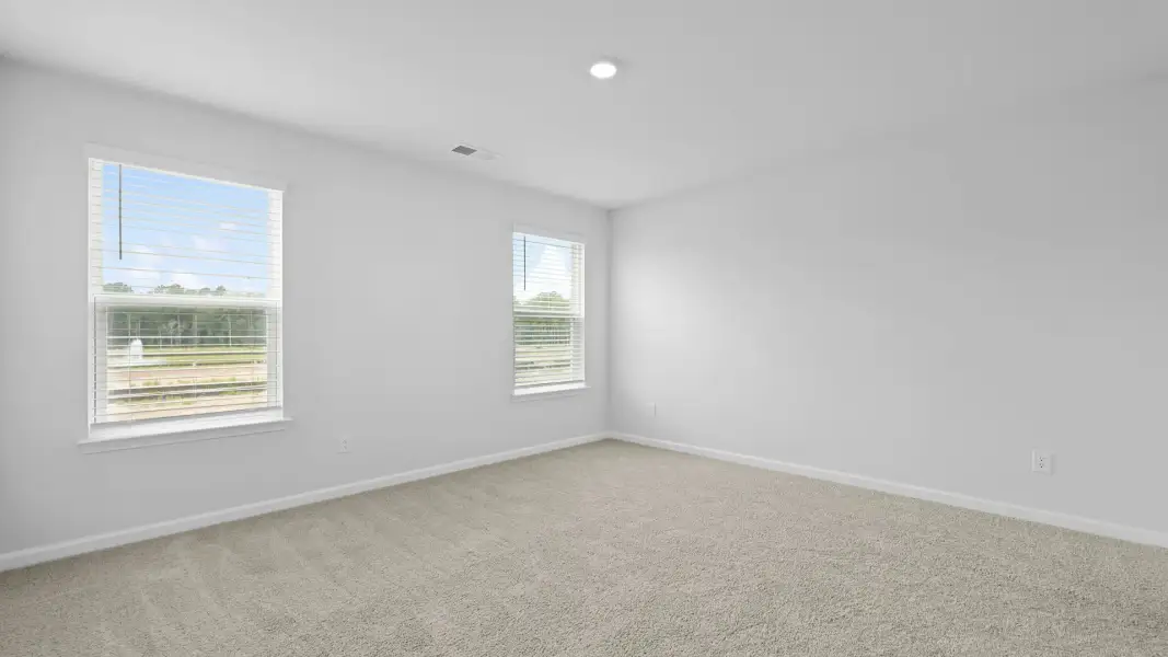 Spacious, unfurnished interior of a new home in Pine Hills Townhomes at Cane Bay, Summerville (Image 27). Spacious, unfurnished interior of a new home in Pine Hills Townhomes at Cane Bay, Summerville (Image 27).
