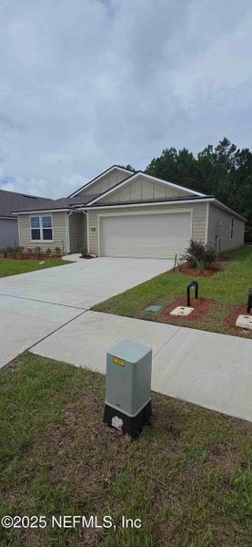 Front exterior of a new home in The Arbors, Jacksonville, FL, highlighting curb appeal (Image 32).