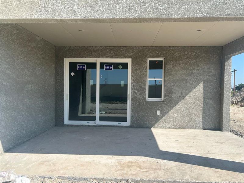 Exterior details and patio area of a home in Oakfield Trails, Parrish (Image 3).