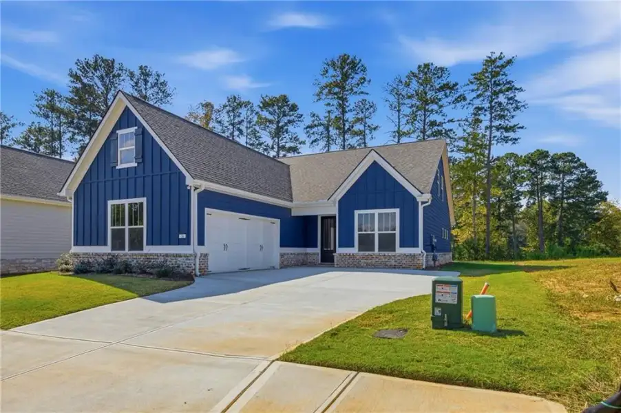 Front exterior of a new home in Heritage Pointe at The Georgian, Villa Rica, GA, highlighting curb appeal (Image 2). Front exterior of a new home in Heritage Pointe at The Georgian, Villa Rica, GA, highlighting curb appeal (Image 2).
