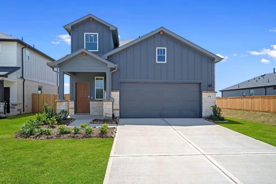 Front exterior of a new home in River Ranch, Dayton, TX, highlighting curb appeal (Image 1). Front exterior of a new home in River Ranch, Dayton, TX, highlighting curb appeal (Image 1).