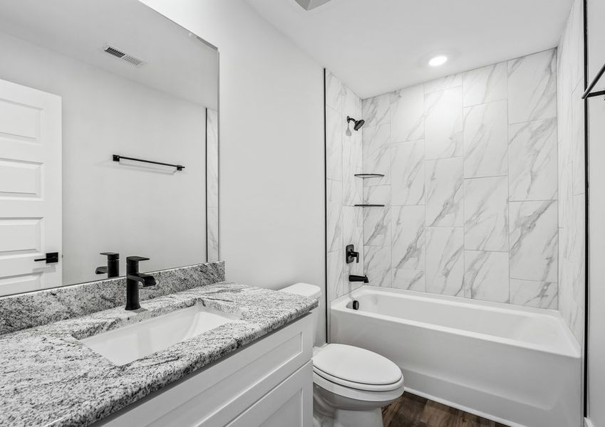 The secondary bathrooms offer plenty of storage. The secondary bathrooms offer plenty of storage.