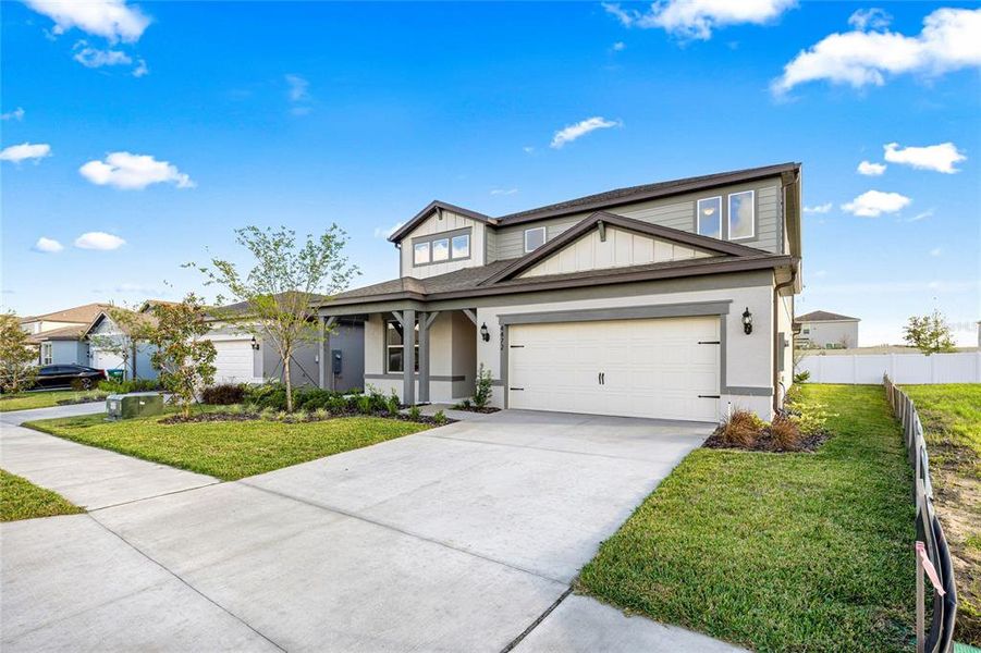 Front exterior of a new home in , Ocala, FL, highlighting curb appeal (Image 25).