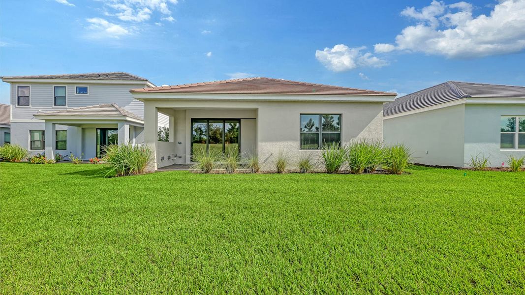 Exterior details and patio area of a home in Palm Grove Real Estate and Homes for Sale in Lakewood Ranch, FL - Neal Communities, Lakewood Ranch (Image 28). Exterior details and patio area of a home in Palm Grove Real Estate and Homes for Sale in Lakewood Ranch, FL - Neal Communities, Lakewood Ranch (Image 28).