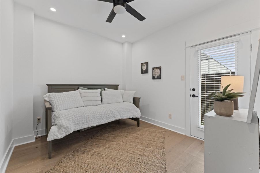 Stylish and versatile secondary bedroom situated on the first floor, offering direct access to the backyard through elegant glass patio door. This sunlit space features warm-toned flooring, soft neutral walls, and generous room for a queen-sized bed and additional furnishings. Outdoor access enhances the room’s appeal for relaxation, remote work, guest room. Stylish and versatile secondary bedroom situated on the first floor, offering direct access to the backyard through elegant glass patio door. This sunlit space features warm-toned flooring, soft neutral walls, and generous room for a queen-sized bed and additional furnishings. Outdoor access enhances the room’s appeal for relaxation, remote work, guest room.