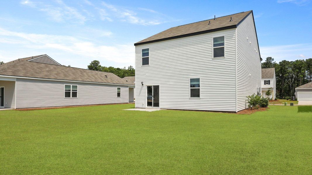 Exterior details and patio area of a home in Pine Hills at Cane Bay, Summerville (Image 18).