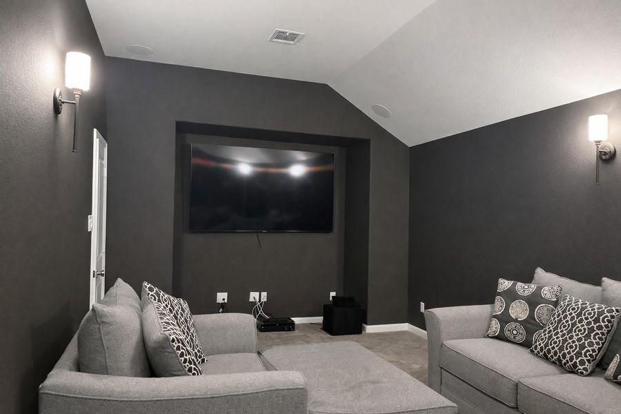 Ideal for family movie nights, this spacious media room offers the perfect viewing experience.