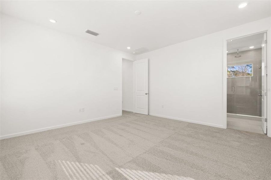 Spacious, unfurnished interior of a new home in Serenade at Ovation, Winter Garden (Image 17).