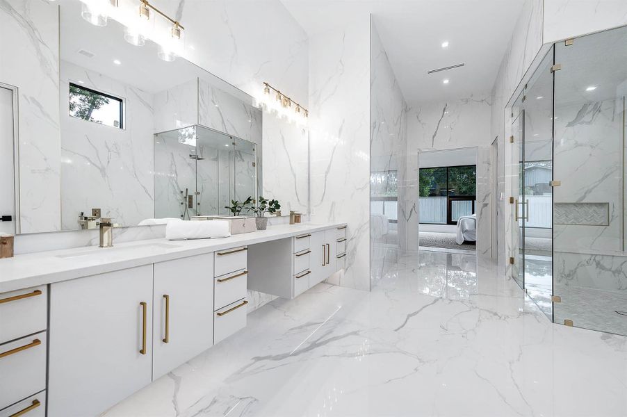 Dual vanity with generous seating space and a striking 10-foot mirror, combining functionality and elegance for a luxurious bathroom experience