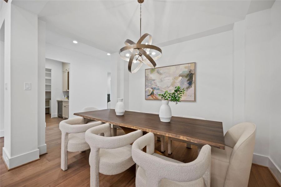 Elegant formal dining room with a striking French-pointed ceiling. Elegant formal dining room with a striking French-pointed ceiling.