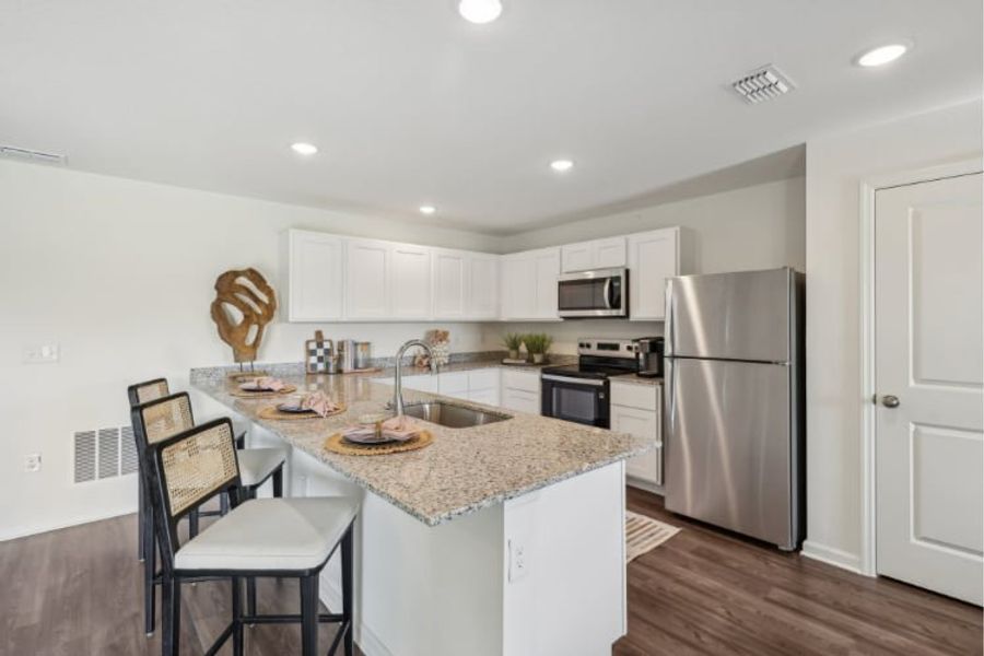 A kitchen with white cabinets. A kitchen with white cabinets.