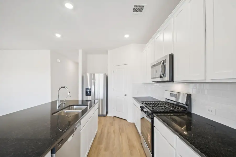 Furnished interior view inside a new home in , Conroe (Image 4).