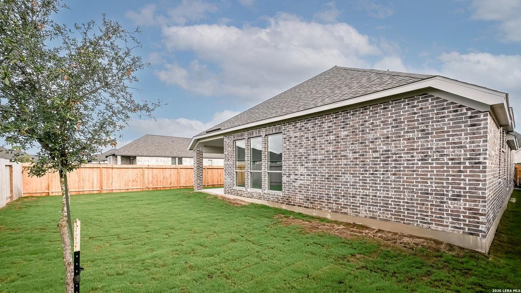 Exterior details and patio area of a home in Meadows of Mill Creek, Seguin (Image 21).