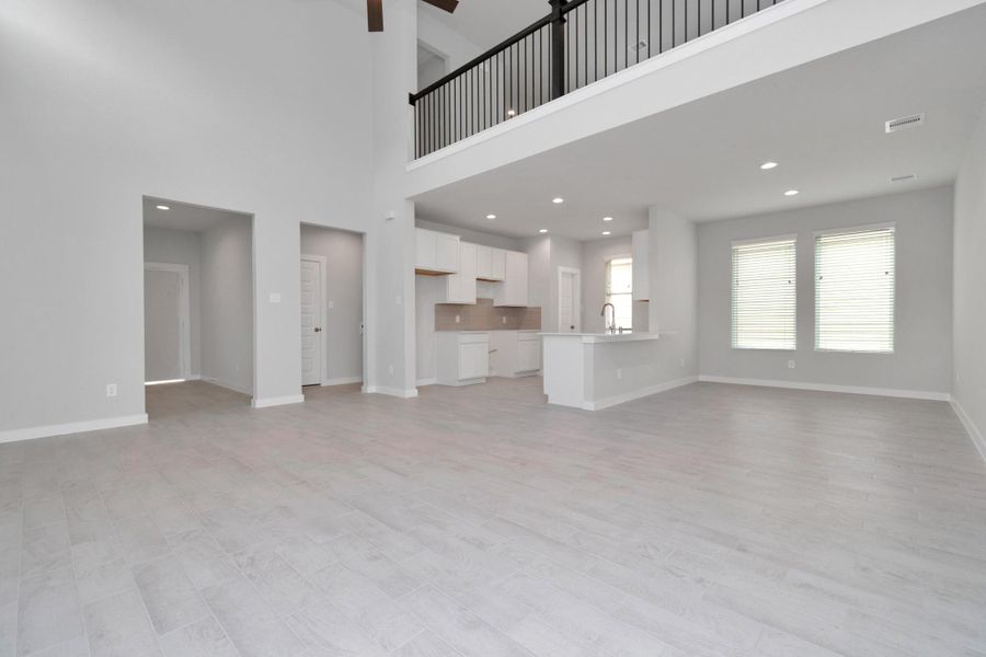 View from family room. Open concept feel where all spaces connect seamlessly. Sample photo of completed home with similar floor plan. Actual colors and selections may vary.