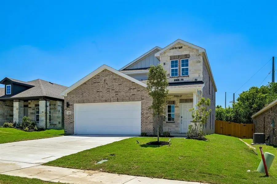 Front exterior of a new home in Sperling Farms, Ferris, TX, highlighting curb appeal (Image 2). Front exterior of a new home in Sperling Farms, Ferris, TX, highlighting curb appeal (Image 2).