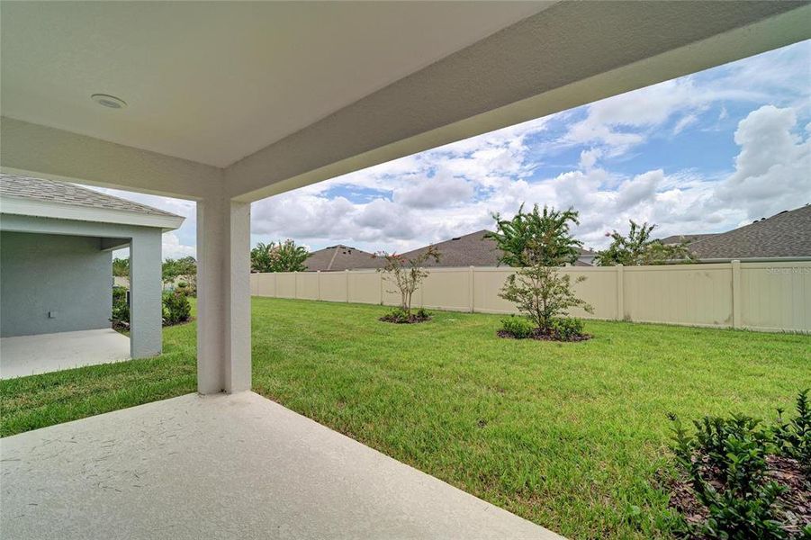 Exterior details and patio area of a home in Crosswind Point, Parrish (Image 13).