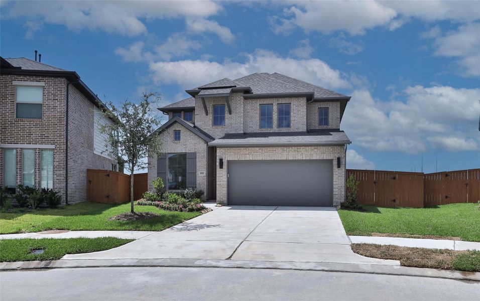 Front exterior of a new home in Marvida 45' - Gated, Cypress, TX, highlighting curb appeal (Image 1). Front exterior of a new home in Marvida 45' - Gated, Cypress, TX, highlighting curb appeal (Image 1).