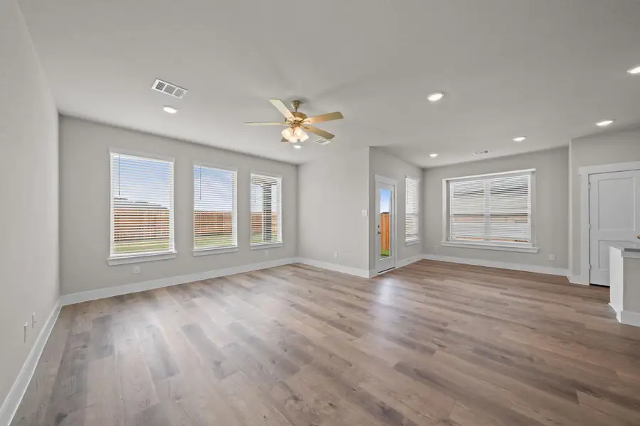 Picture expansive windows that invite natural light to dance through spacious living areas, creating a welcoming atmosphere perfect for gatherings or quiet moments of reflection. REPRESENTATIVE PHOTO