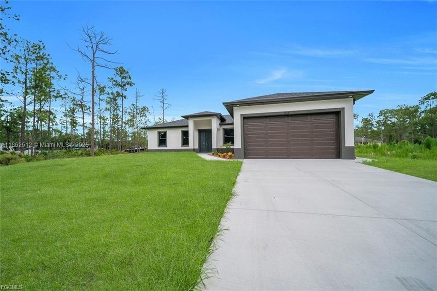 Front exterior of a new home in , Lehigh Acres, FL, highlighting curb appeal (Image 15).