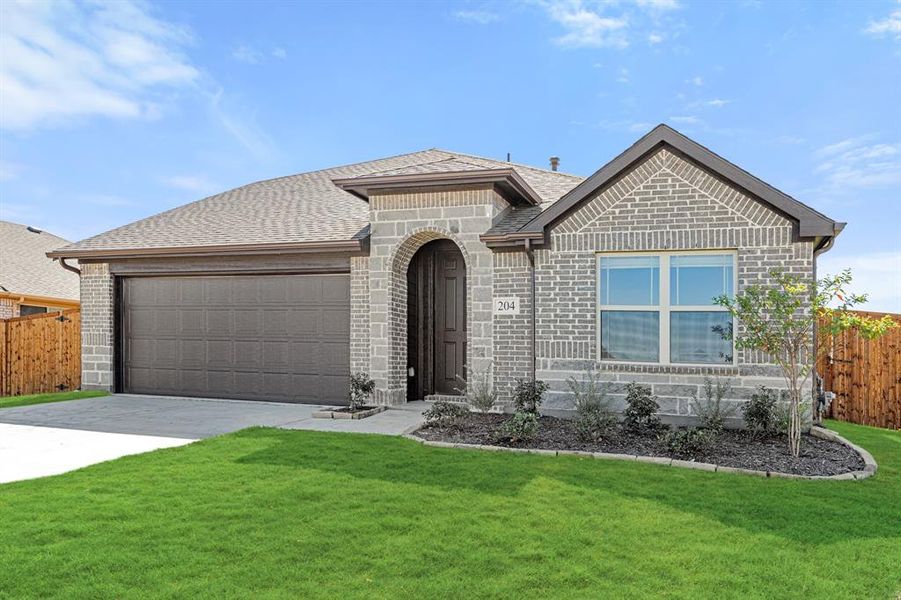 Front exterior of a new home in East Oak Creek Elements, Commerce, TX, highlighting curb appeal (Image 1).